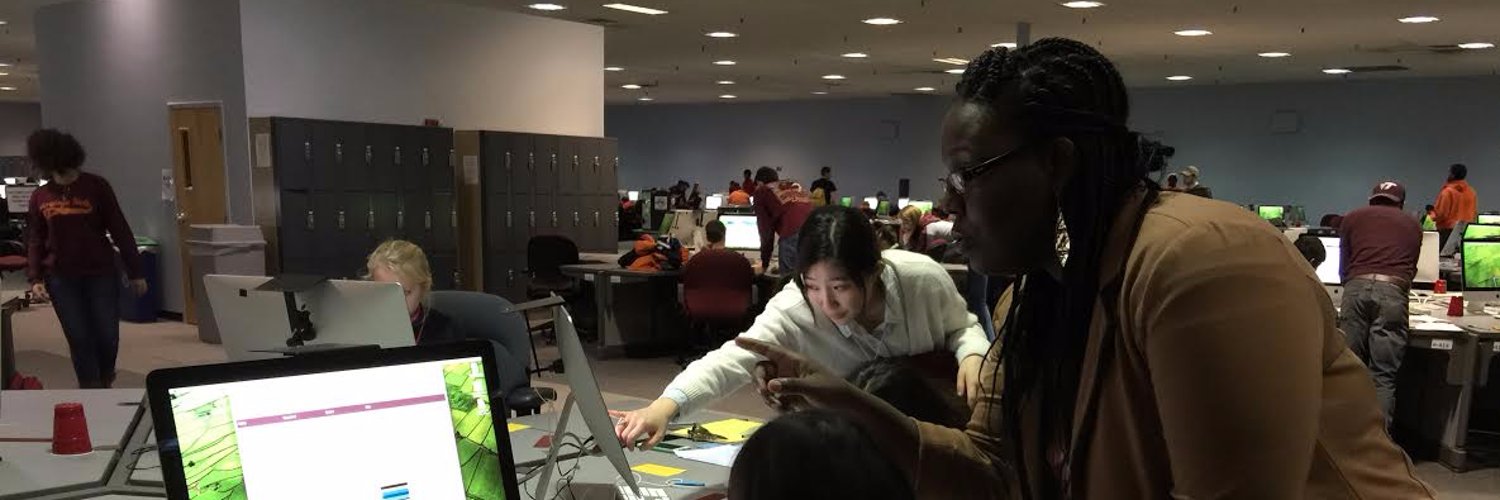 Shernita Lee and student looking at computer screen